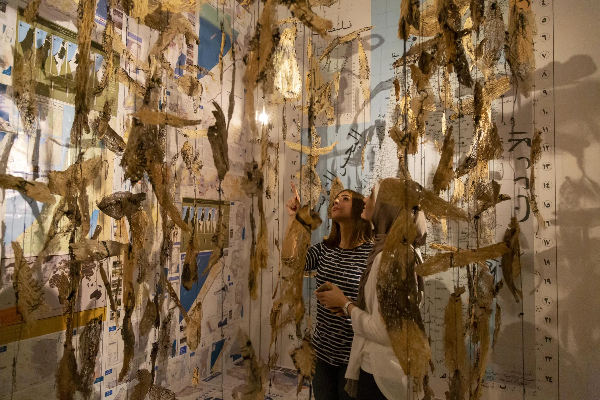 Visitor exploring an installation at the Palestinian Museum